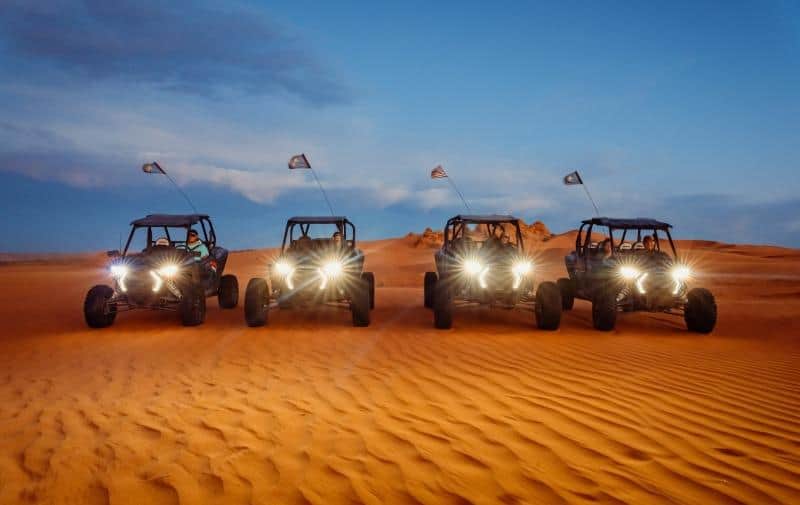 ATVs riding on the sand