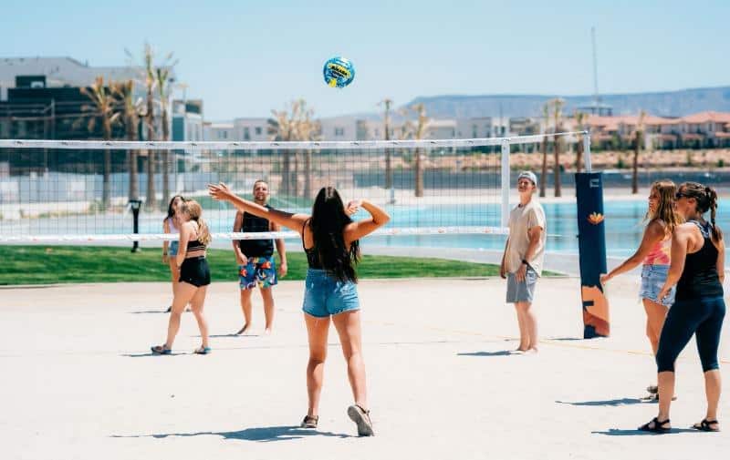 group of friends playing volleyball